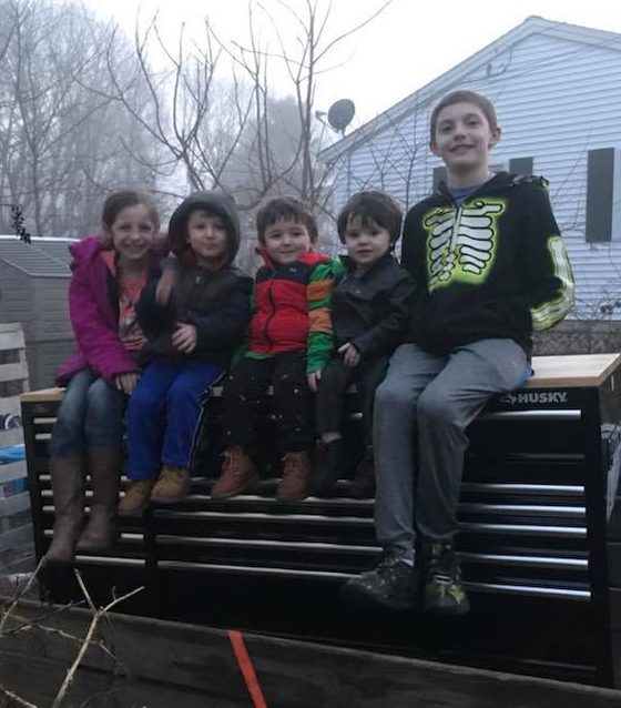 Kids on Toolbox junk removal trailer